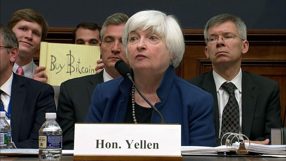 Yellow notepad Buy Bitcoin photobomb of Janet Yellen during testimony to Congress